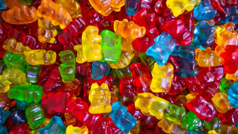 A full page of gummy bear candies in an assortment of colors.